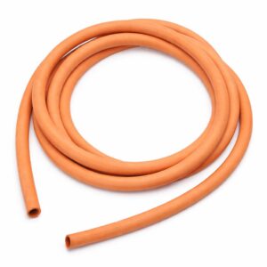 Flexible orange rubber hose coiled in circular shape isolated on white background, industrial tubing product photo.